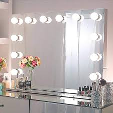 Behind those sleek pink panels lie 21 sparkling led lights illuminating three. Amazon Com Chende Large Hollywood Mirror With Lights 31 5 X 23 62 Inches Lighted Vanity Mirror With Outlet By The Side Replaceable Led Bulbs And Stainless Steel Frame Wall Mounted Makeup Mirror Home