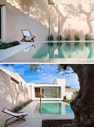 A Small Pool Is Positioned Between A House And Studio Space With Lighting Highlighting The Dramatic Design Of The Swimming Pools Backyard Pool Swimming Pools