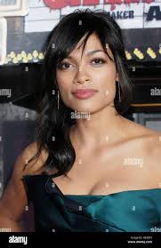 Rosario Dawson arriving at the Grindhouse Premiere at the Orpheum Theatre  In Los Angeles. headshot eye contact smile dark green dress 01  DawsonRosario055 Red Carpet Event, Vertical, USA, Film Industry,  Celebrities, Photography,