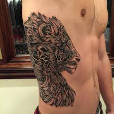 Graphic Line Work Lion Tattoo Design Done By Angel Antonio Morillas You Can Find Him Tattooing At Black At Side Tattoos For Men Mens Side Tattoos Side Tattoos