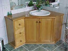 This single corner vanity is carefully handcrafted of sturdy wood and measures 32 3/4w x 24d x 36 1/4h with vintage oak with cream stone top construction. Corner Bathroom Cabinets Corner Bathroom Vanity Corner Sink Bathroom Trendy Bathroom
