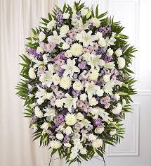 Sympathy flowers are typically small bouquets sent to a grieving person's home or office. Lavender And White Funeral Standing Spray 1800flowers Com 148719