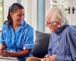 Image of person with dementia reminiscing with a loved one
