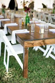 White Folding Chairs With Wood Farm Tables Farm Table Wedding Farm Table White Chairs Wedding