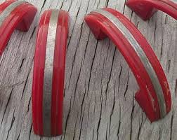 As well as vintage cupboard handles, drawer handles and cabinet knobs, there are many other vintage and period styled items to create a retro décor theme that perfectly shows your style and character. Vintage Bakelite Red Drawer Pulls Cupboard Cabinet Handles Drawer Pulls Mid Century Drawer Pulls Mid Vintage Cabinet Hardware Cupboard Handles Cabinet Hardware