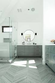 Find ideas and inspiration for herringbone wood floors to add to your own home. Dark Gray Wood Like Herringbone Floor Tiles Set An Appealing Dimensional Tone To The Large Open Conc Grey Wood Tile Gray Wood Tile Flooring Wood Floor Bathroom