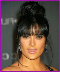 High bun with floral accessories. African Braids With Bangs Shefalitayal