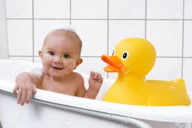 We love the option to fill the water level up higher than many. Cute Baby Girl Sitting In A Bathtub With A Rubber Duck Stock Photo Picture And Royalty Free Image Image 36051025