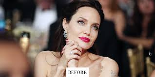 Textured brown hair styled in long layers that fall well past her shoulders. Angelina Jolie Is Blonde Again Angelina Jolie Blonde Hair For Come Away Movie