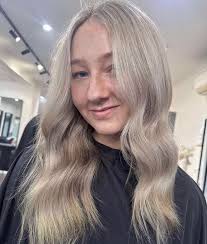 Rapture Hair and Beauty added a...