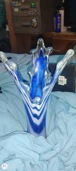 This is a beautiful vase great Christmas present or birthday. 13 inches  tall at its longest point