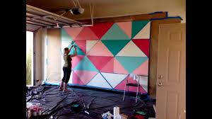It's easy to create wall painting designs yourself that look beautiful even if you don't think you're artistic. How To Paint A Giant Geometric Feature Wall Mural Youtube