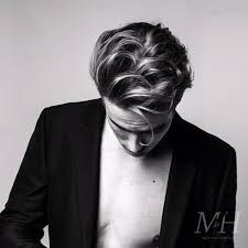 Rockabilly hairstyles, also known as greaser hair, have become a popular men's style trend. Modern Rockabilly Pompadour Man For Himself