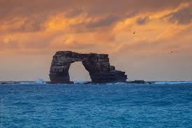 The top of darwin's arch, the famous natural stone archway in the northern galapagos islands, has crashed into the waves, according to news reports. Darwin S Arch In Sunset By Song Heming