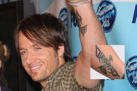 He made sure to wear a shirt that reveals his arms to the crowd. Keith Urban Tattoos Keith Urban Songs