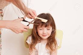 Woman Cuts The Baby Hair The Girl Is Afraid To Cut Hair He Closed His Eyes With Fear The Background Image Place For Text Stock Photo Picture And Royalty Free Image Image