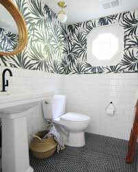 Black And White Penny Tile Designs Black And White Bathroom Black Penny Tile On Floor White Subway Tile On Walls Palm Frond Wallpa White Bathroom Tiles Bathroom Makeover Bathroom Tile Designs
