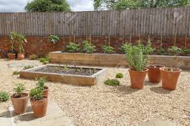 Plan to line the raised garden beds with bricks, cement blocks, or anything else you desire. Raised Beds In A Kitchen Vegetable Garden With Hard Landscaping Stock Photo Picture And Royalty Free Image Image 127565890