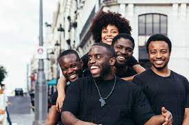 Happy black race friends hanging out in the city in a summer day. stock  photo