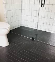11 Bathrooms With Black Herringbone Tiles Black Bathroom Floor Black Tile Bathrooms Black Bathroom