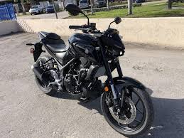 Metallic gray, blue with black, and black. 2021 Yamaha Mt 03 Riva Motorsports Miami
