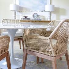 Woven Dining Chairs With White Vinyl Upholstered Seat Dining Table With Tulip Base And Marb Woven Dining Chairs Neutral Dining Room Lounge Chairs Living Room