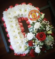 Sympathy flowers are the most common gift for people who are grieving the death of a loved one, but knowing which type to send can be difficult. Funeral Tribute Letter D For A Manchester United Fan Red And White Flowers Designed Tiger Lilies Florist Red And White Flowers Tiger Lily Flowers Manchester