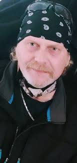 He looks gentle I also see some letters maybe