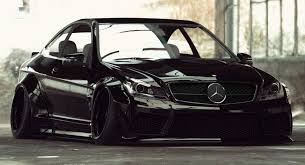 Liberty Walk Puts A Jdm Touch On Mercedes Benz C63 Amg Coupe Carscoops Mercedes Benz C63 Amg Mercedes Benz C63 Mercedes Benz Cars