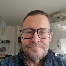 What is the purpose of a small metal container with a bird figure and seven  petal-type bulbs?