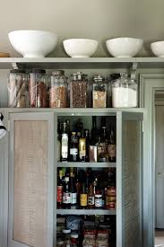 She utilized the space above the cabinets for simple open shelving that let s the. Martha Stewart S Kitchen Tips Popsugar Home