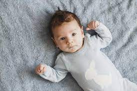 See more ideas about cute babies, cute kids, baby pictures. Newborn Pretty Baby Boy In Blue Sleepwear Lying On Grey Sheet Top View Stock Image Image Of Newborn Beautiful 134556743
