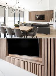 Black Accent Wall Living Room Tv Design Detail A Wood Slat Accent Wall Surrounds The Tv In This Living Room Accent Walls In Living Room Living Room Tv Wall Wood Walls Living Room