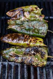 Maybe you would like to learn more about one of these? Grilled Poblano Peppers That Have Been Roasted On A Grill Over A Flame Until The Skins Are Charred Stuffed Poblano Peppers Stuffed Peppers Grilled Roast