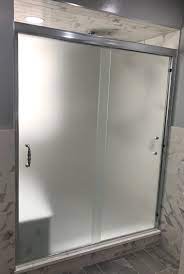 Semi Frameless Sliders For Shower Stall With Satin Etch Glass And Spindle Hand Etched Glass Shower Doors Glass Shower Enclosures Frameless Bypass Shower Doors
