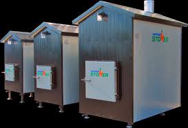The ventilation system is attached through a chimney for a clean airy house. Outdoor Wood Furnace Ontario Biomass Energy Northern Stoker Canada