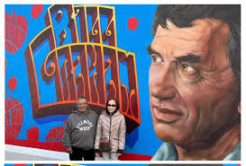 My Husband and I are standing the Mural of Bill Graham was dedicated