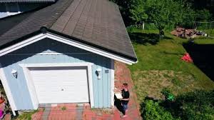 It's typically made of three sections, which are mounted horizontally and hinged together. Garage Door Stock Video Footage Royalty Free Garage Door Videos Page 23