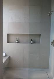 Neutral Matte Grey Large Scale Tiles Inspired By Concrete For A Modern Bathroom Recessed Shower Shelf Modern Bathroom Large Tile Bathroom