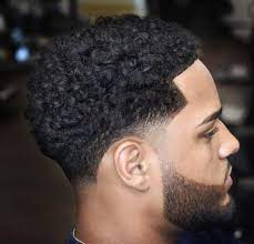 The popularity of this mens haircut fade lies in its clean look, and with gradual fading on #2: Temple Taper Curly Hair Novocom Top