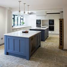 A single island may help divide the kitchen into a working area and socializing space, two can make an even better distinction. Kitchen Design Double Island Mass Idea