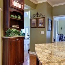 Golden Oak Wood Floor With Sage Green Walls I Also Like The Crown Molding Maybe Use This In The Kitchen Popular Kitchen Paint Colors Green Kitchen Walls Home