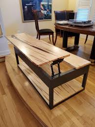 One shelf at the bottom and metal decorative feet. Ambrosia Maple Box Frame Coffee Table With Lift Top Ana White