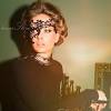 Masquerade mask made with black glitter rhinestones and feathers. 1