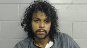 Man with hatchet enters crime scene, head-butts officer