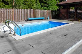 #1 envision a small square shaped swimming pool in a backyard enclosed by a wooden platform #13 narrow swimming pool ideal for a small backyard Can You Put An Inground Pool In A Small Backyard