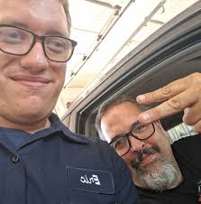 What is the signature of the person in the photo?