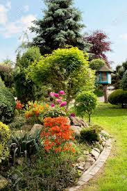 Check spelling or type a new query. Beautiful Spring Garden Design With Conifer Trees Green Grass Stock Photo Picture And Royalty Free Image Image 60230362