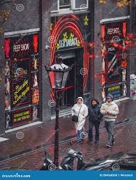 A Rainy and Windy Day in the De Wallen Red Light District of Amsterdam.  Editorial Stock Photo - Image of brothel, people: 284660208
