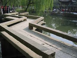 The Zig Zag Bridge A Zig Zag Bridge Is Often Seen In East Asian Gardens It May Be Made Of Stone Slabs Or Planks As Pond Design Asian Garden Chinese Garden